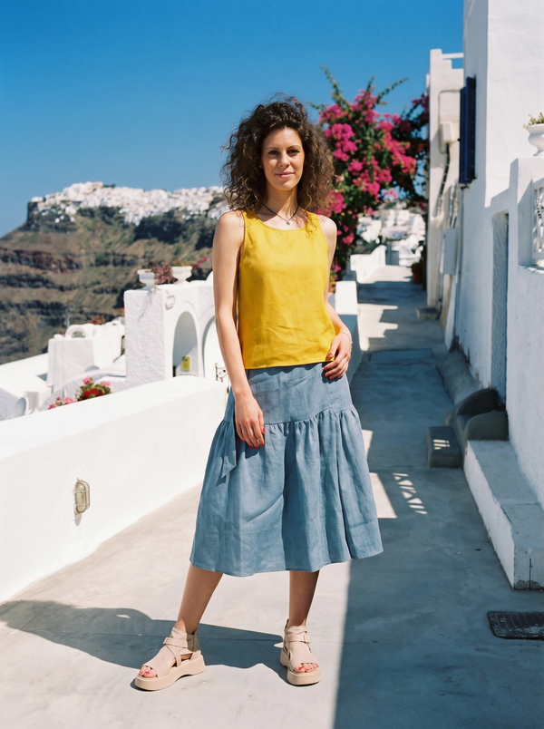 Mustard linen cami top with cross-back straps on Cycladic whitewashed path — Souls In Clothes