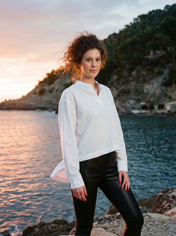 White cotton mandarin-collar asymmetric-hem shirt on Mediterranean sunset cove — Souls In Clothes